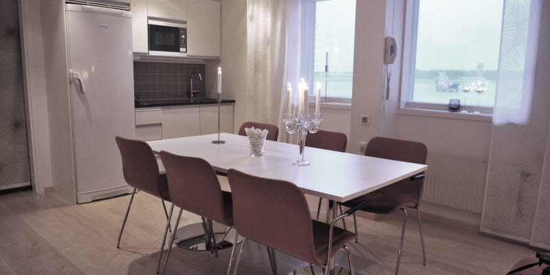 Conference room at Luleå Airport with a lit candelabrum at a table