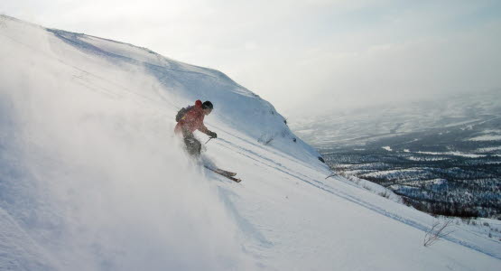 A person skiing down a hill