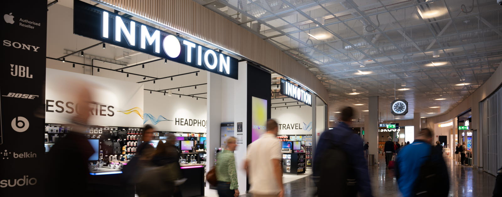 People walking past Inmotion store.