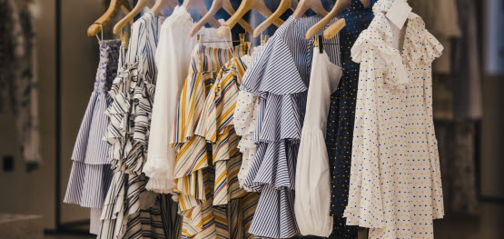 Women's clothing hanging on a rack.