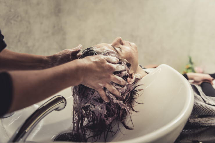 Women getting her hair washed