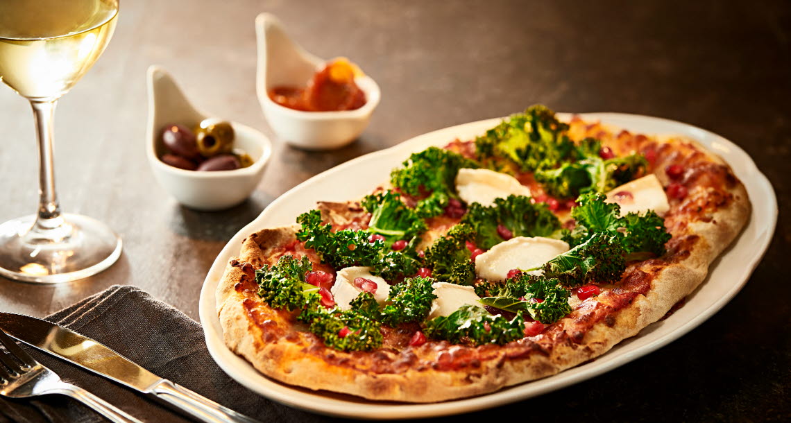 Pizza with chèvre and kale