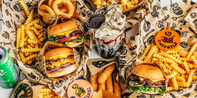 Hamburgers, fries, onion rings and an Oreo milkshake.