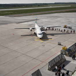 Travelers leave an aircraft at Visby Airport