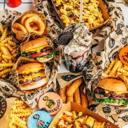 Hamburgers, fries, onion rings and an Oreo milkshake.