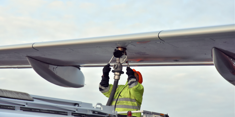 Crew refueling an aircraft with biofuel