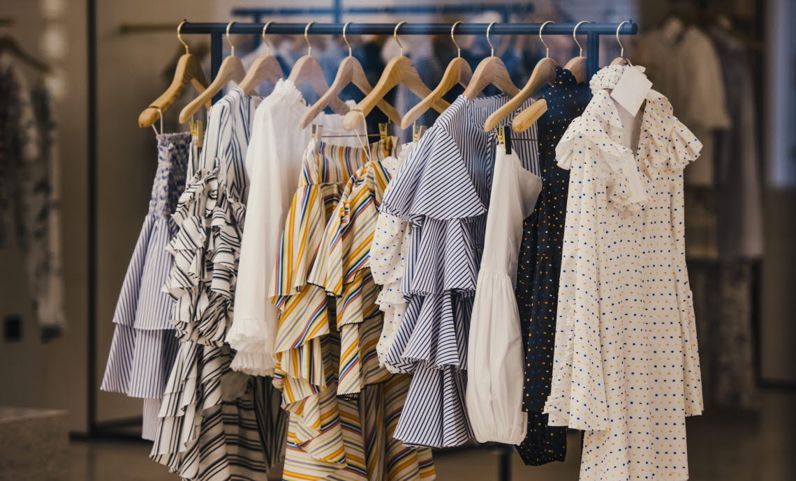 Women's clothing hanging on a rack.