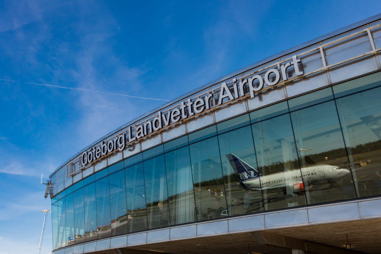 Gothenburg Landvetter Airport with blue sky and an aircraft that reflects in the glass