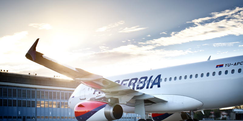 Air Serbia aircraft in front of building