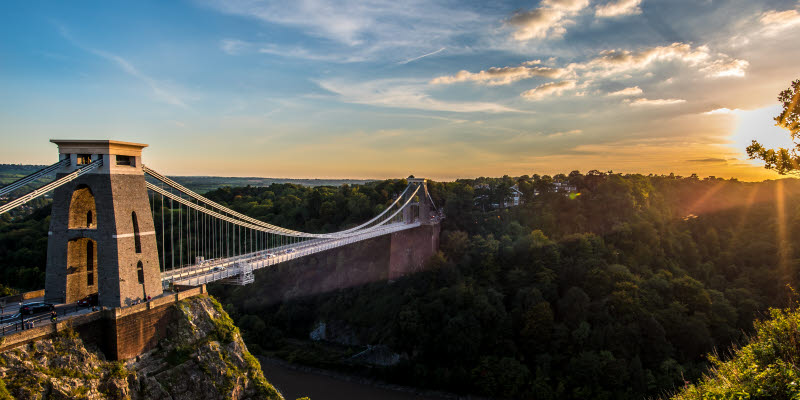 Clifton Suspension Bridge, Bristol, UK with sunset and sunbeams