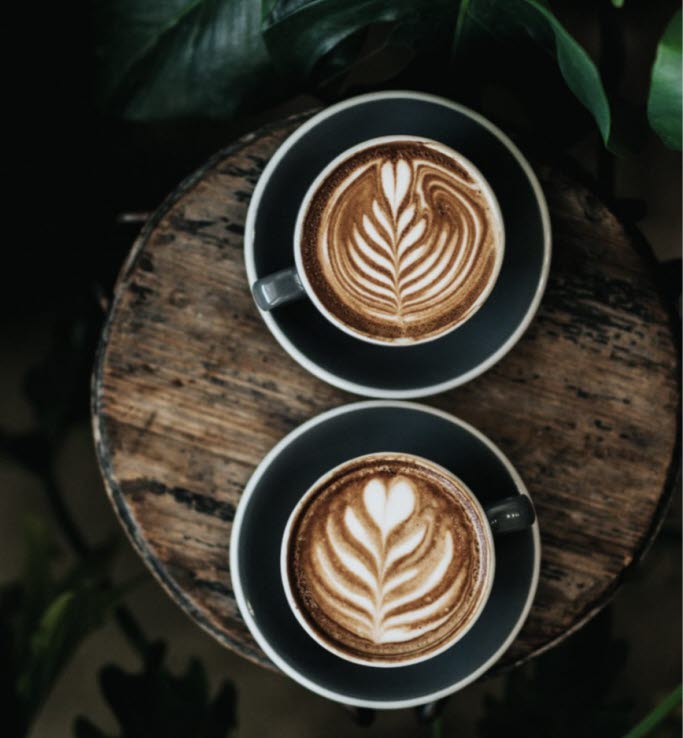 Coffee cups on wooden table