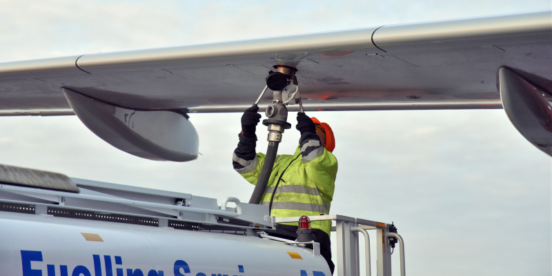 Crew refueling an aircraft with biofuel