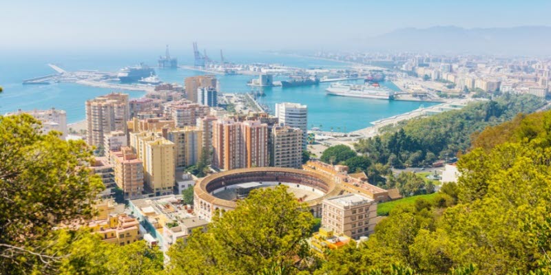 View of Malaga with bullring and harbor. Spain