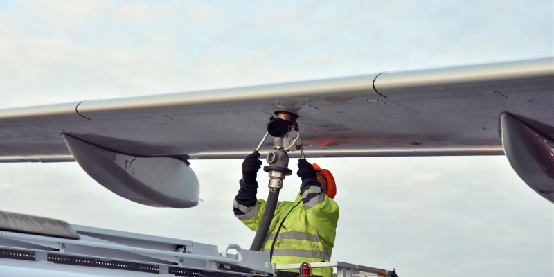 Crew refueling an aircraft with biofuel