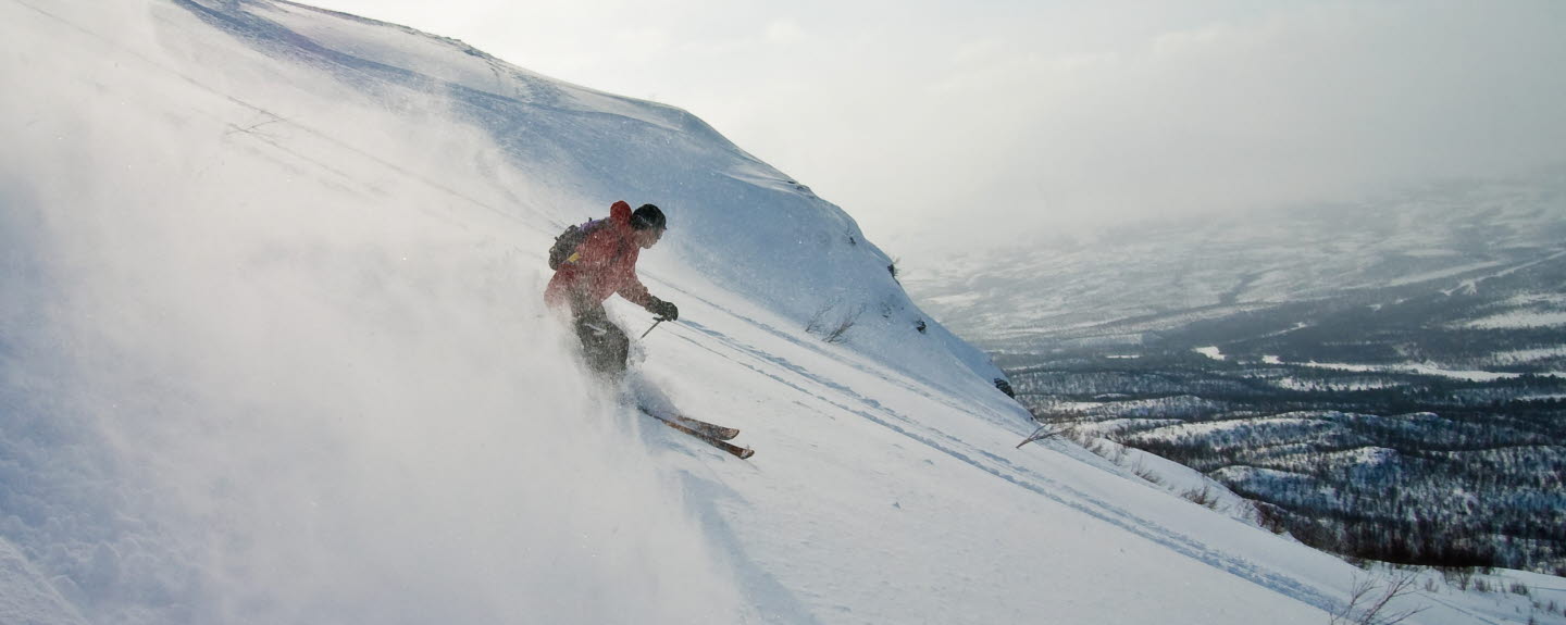A person skiing down a hill